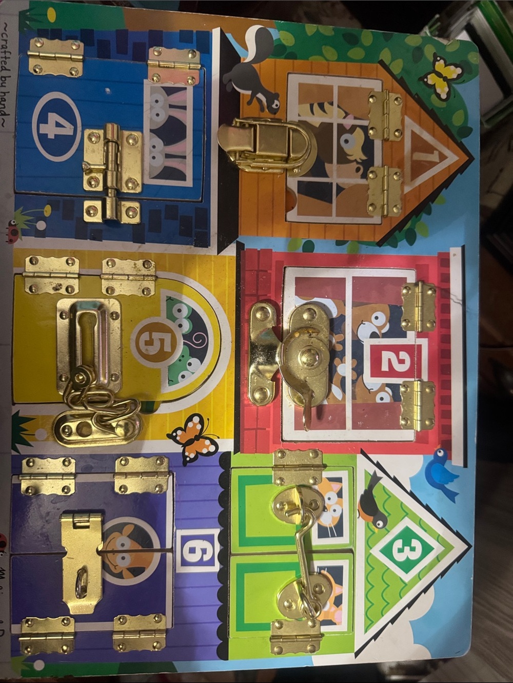 Melissa & Doug Colorful Busy Board with Gold Latches and Doors